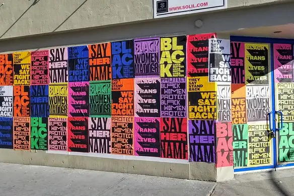 Colorful posters with the message Black Lives Matter adorn a NYC construction wall.